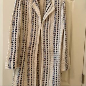 St John long jacket with tassels on the bottom, secure hook in front.